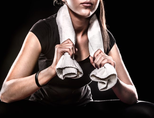 Power Fitness Girl With Towel On Black Background